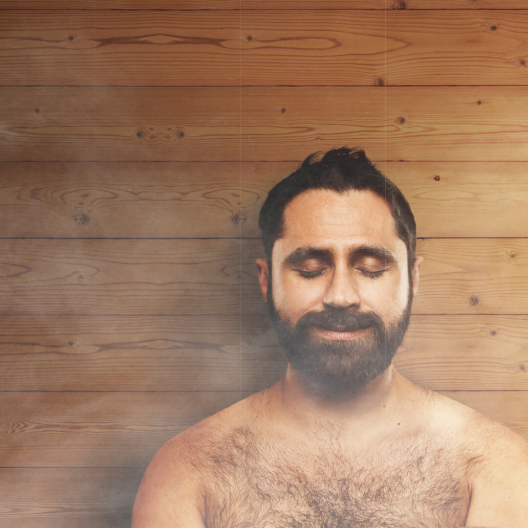 A person relaxing inside a Thermory barrel sauna